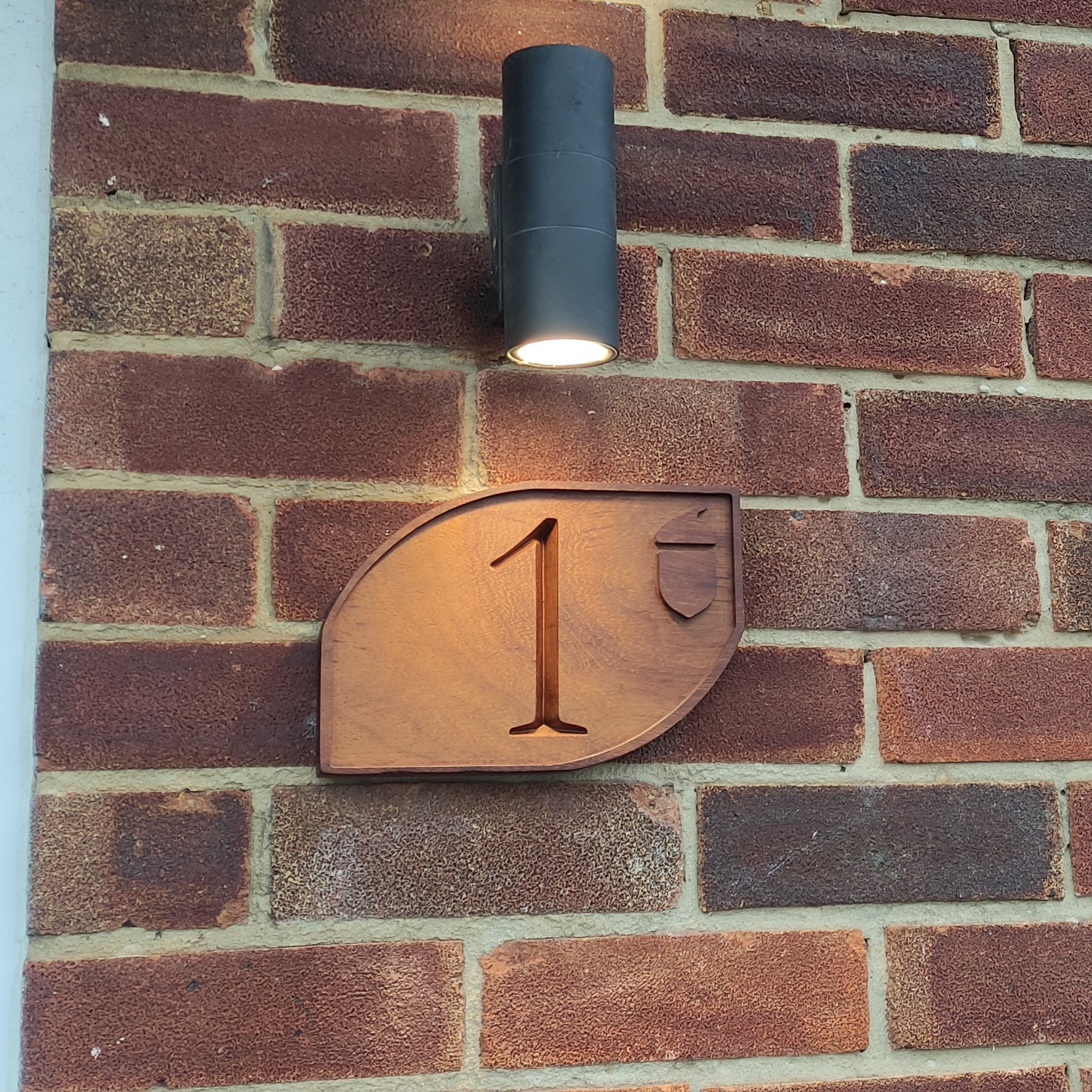 Wooden house name sign